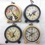 1pc CLOCK - METAL ALARM CLOCK 12CM 4 ASSORTED DESIGNS